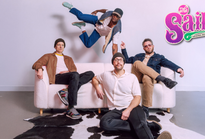 The Get Right Band members on a white couch