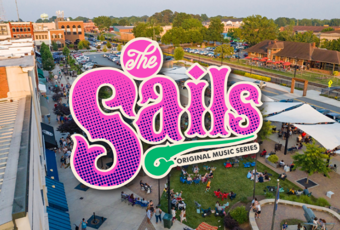 aerial photo of downtown during a music concert with the Sails Original Music Series logo