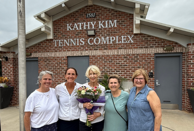 Kathy Kim and others standing in front of the Kathy Kim Tennis Complex