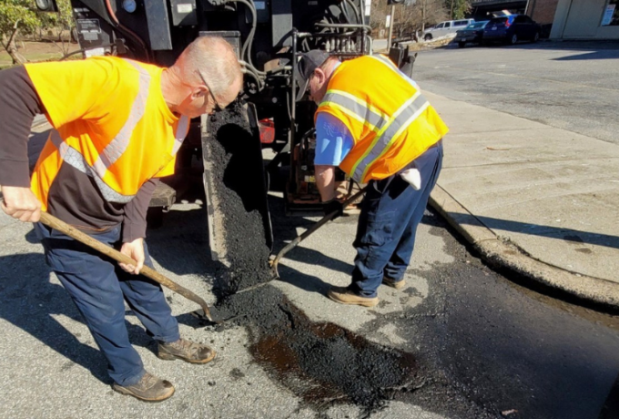 City crews repair a pothole