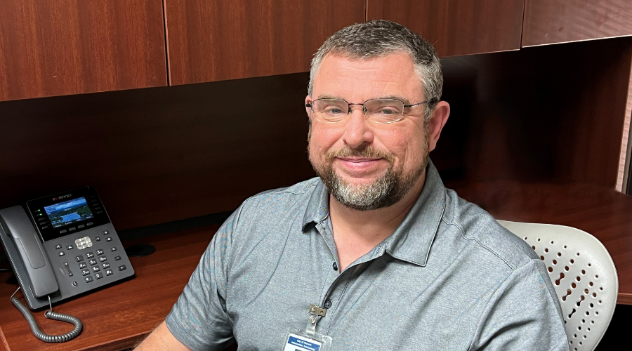 Darin Kiracofe sitting at his desk