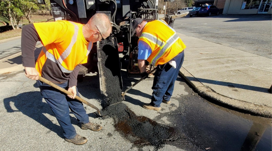 City crews repair a pothole